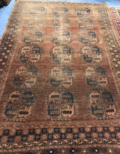 A Bokhara brown ground carpet 316 x 211cm